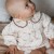 Ruffled collar baby overall with flower print Takara